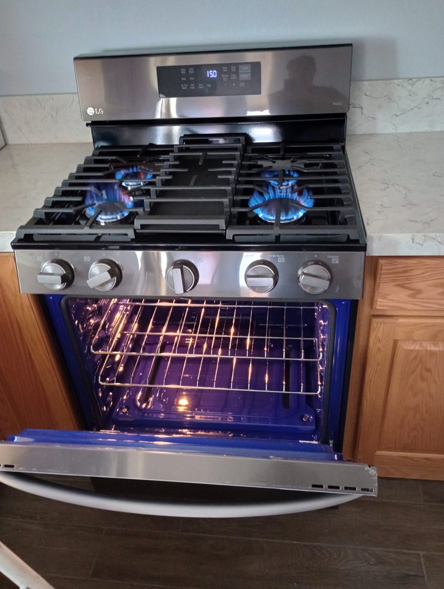 Gas range connected and tested with the burners lit