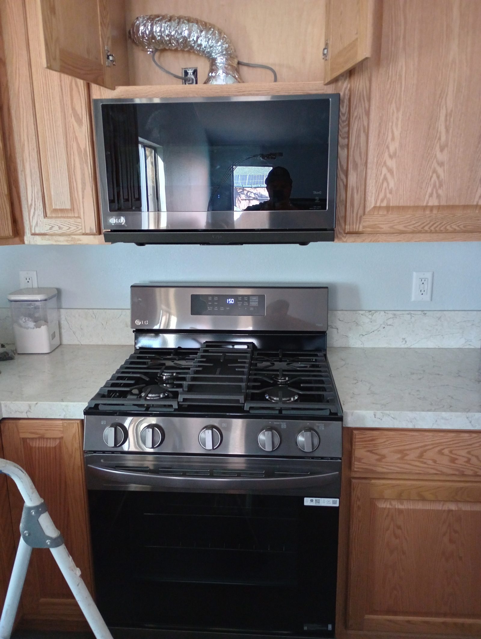 Gas range and over-the-range microwave installed by Superman Handyman 702 in a Las Vegas kitchen