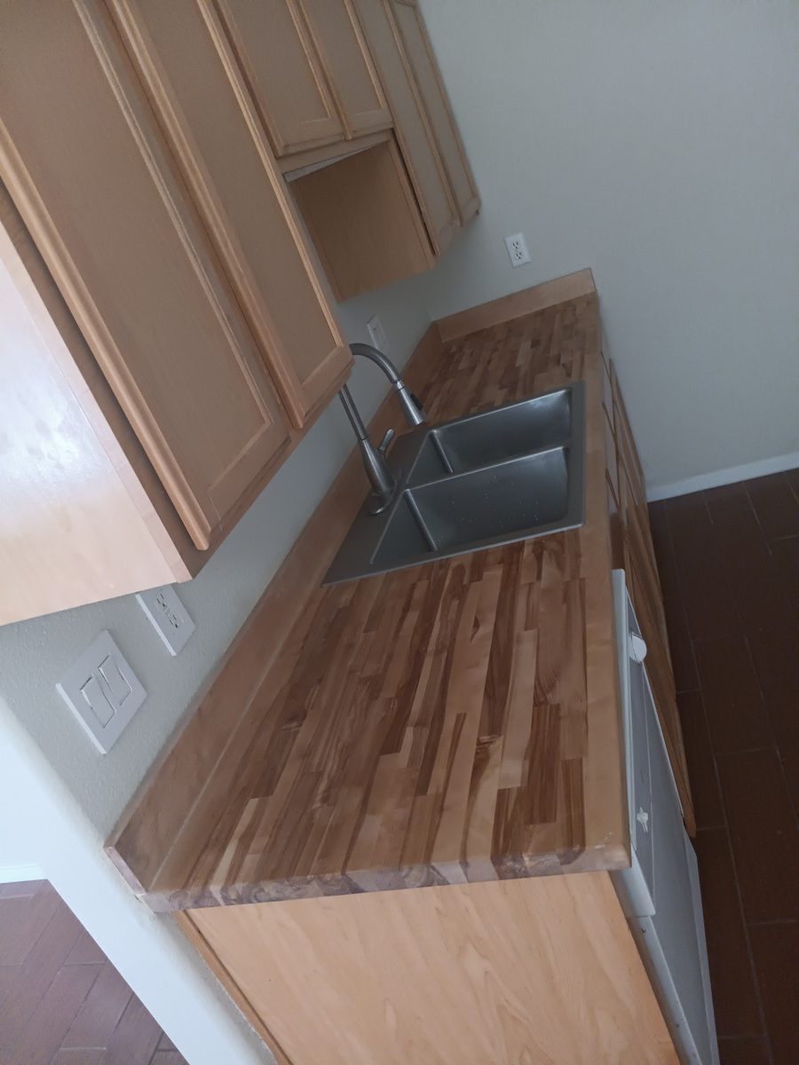 Butcher-block countertop with a new sink and faucet installed
